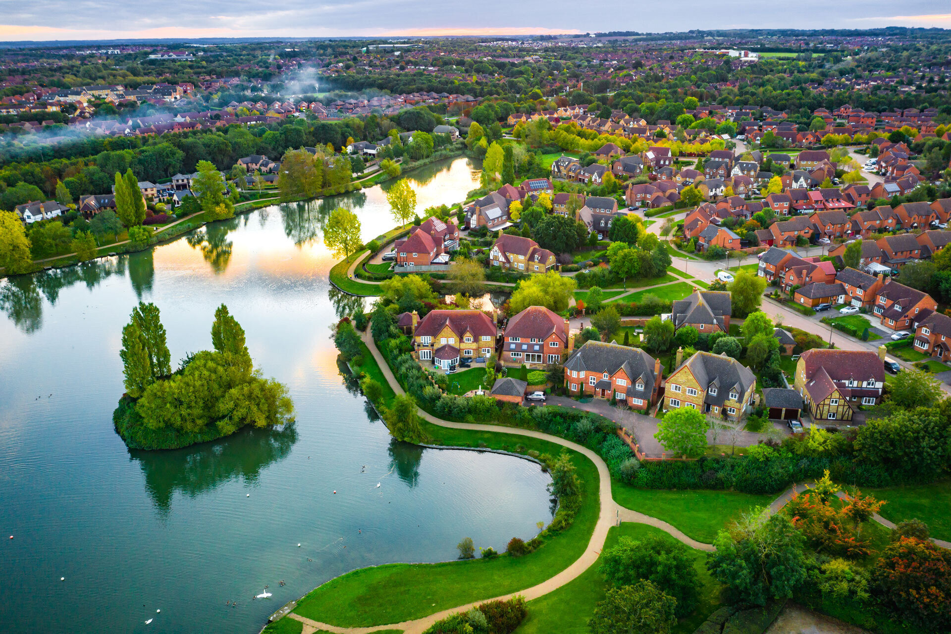 Planning - Overhead view of streets and houses next to lake